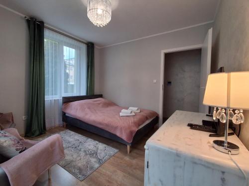 Ένα ή περισσότερα κρεβάτια σε δωμάτιο στο Apartament JOANNA