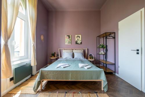 Postel nebo postele na pokoji v ubytování Budapest Central Artpark Suites