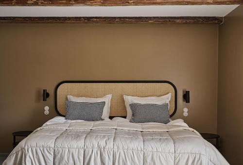 a bedroom with a large bed with two pillows at Stay North - Matri House in Mathildedal