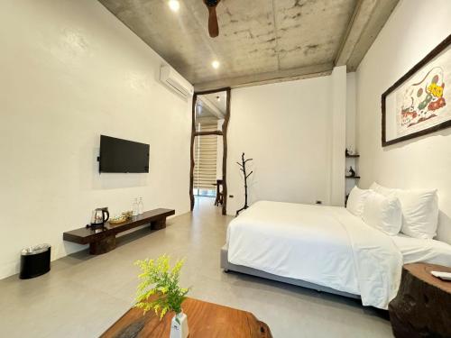 Televisyen dan/atau pusat hiburan di Eco & Rustic Home Hoian
