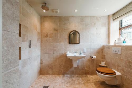 a bathroom with a toilet and a sink at Hever Castle Luxury Bed and Breakfast in Edenbridge
