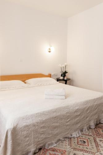 Кровать или кровати в номере Apartments-Rooms Kocijancic