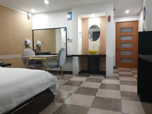 Ένα ή περισσότερα κρεβάτια σε δωμάτιο στο Hotel The Fine