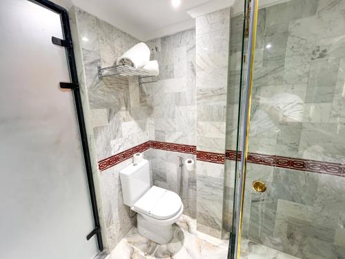 a bathroom with a toilet and a shower at Menzeh Zalagh 2Boutique Hôtel & Sky in Fès