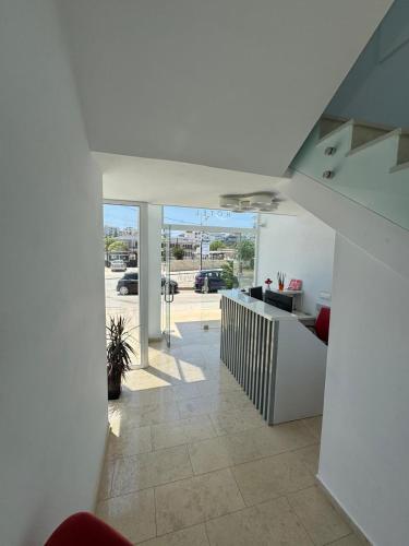a living room with a staircase in a house at Otto Hotel in Ksamil