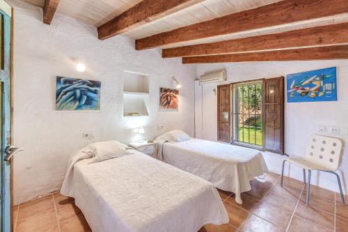 a hospital room with two beds and a window at Son Del Rio Nou in Pollença