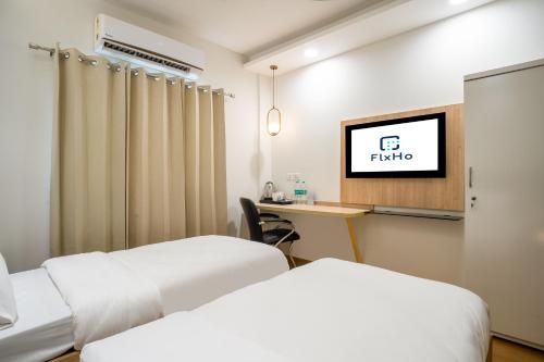 FlxHo Cyber One - Hotel And Banquet- DLF Cyber Cityにあるベッド