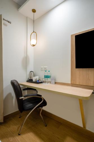 FlxHo Cyber One - Hotel And Banquet- DLF Cyber Cityにあるテレビまたはエンターテインメントセンター