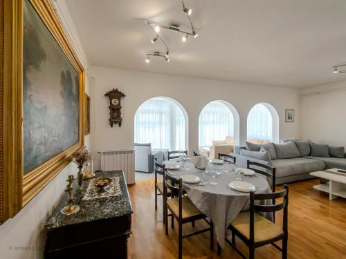 a living room with a table and a couch at Elegant Apartments BOP in Portorož