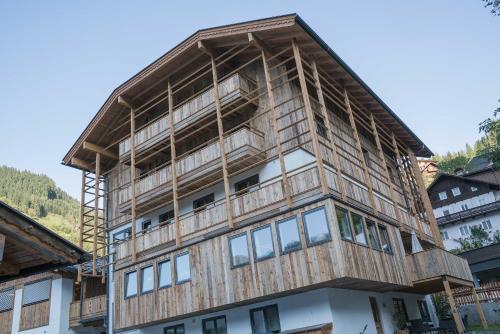 a house being constructed on top of a building at Atelier Garni Astei in Grossarl