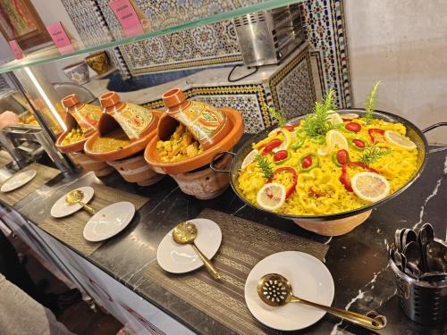 a counter with two bowls of food and spoons at Menzeh Zalagh 2Boutique Hôtel & Sky in Fès