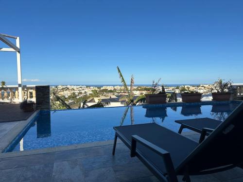 a swimming pool with a view of the city at Villa with Views Parking AC in Mellieħa