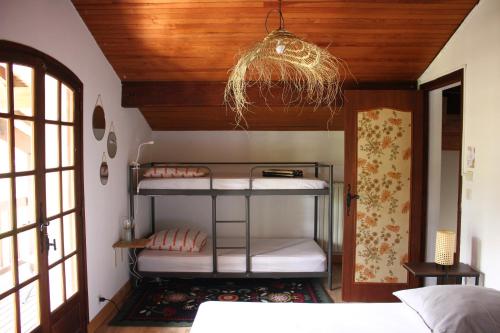 a room with two bunk beds in a bedroom at Yacumama Guesthouse in Soorts-Hossegor