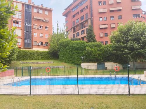 a tennis court in front of some buildings at Fridda House Atocha Madrid in Madrid