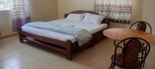 Postel nebo postele na pokoji v ubytování The nest motel kisoro