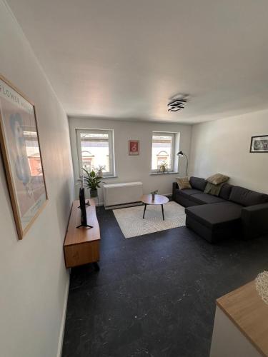 a living room with a couch and a table at Ferienwohnung Zeciri in Gerolstein