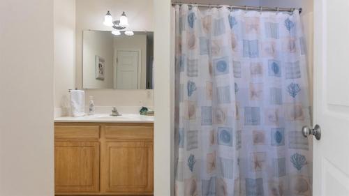 a bathroom with a shower curtain and a sink at 509 E 15Th Ave, Unit F in North Wildwood