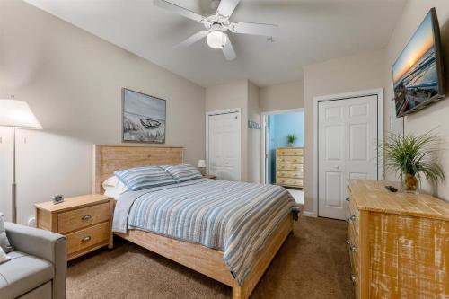 a bedroom with a bed and a ceiling fan at 401 E Stanton Rd, Unit 203 in Wildwood Crest