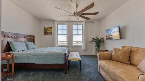 a bedroom with a bed and a couch at Residence 1205 At The Grand in Wildwood