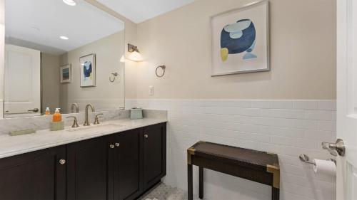 a bathroom with a sink and a mirror at Residence 306 At The Grand in Wildwood