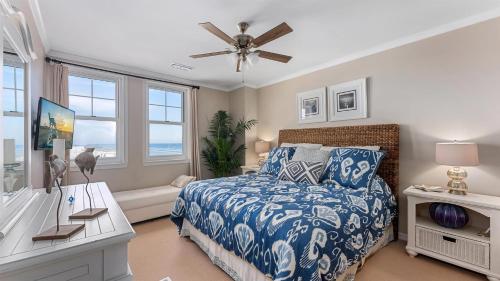a bedroom with a bed and a ceiling fan at Residence 1201 At The Grand in Wildwood