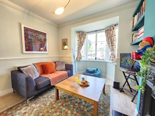 a living room with a couch and a coffee table at Elegant 3BR Home Near Oxford Centre, Garden, WiFi in Oxford