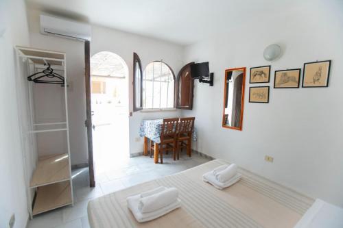 Ένα ή περισσότερα κρεβάτια σε δωμάτιο στο Il Villaggio Del Mago