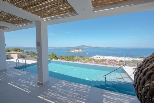 a villa with a swimming pool and a view at Villa Lilianna Private Luxury Villa in Marathias