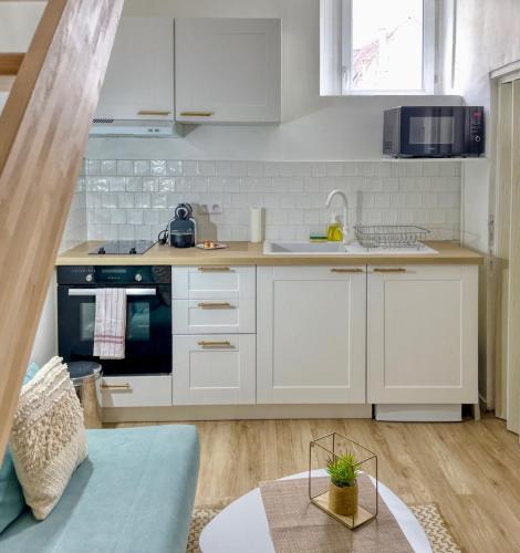 Η κουζίνα ή μικρή κουζίνα στο Le Cosy Duplex