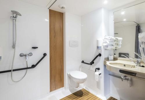 a bathroom with a toilet and a sink and a shower at B&B HOTEL Perpignan Saleilles in Perpignan