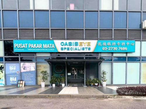 a building with a sign on the front of it at JB Danga Bay Cozy 2BR by Viesel Group - Netflix, WiFi, Free Parking in Johor Bahru