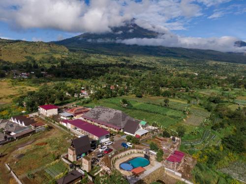an aerial view of a house with a mountain in the background at Asri Rinjani Hotel in Sembalun Lawang