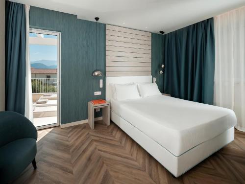 Postel nebo postele na pokoji v ubytování Hotel Tirrenia