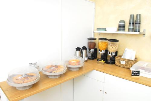 a kitchen counter with bowls of food on it at La Pergola Private Parking in Vezzano Ligure