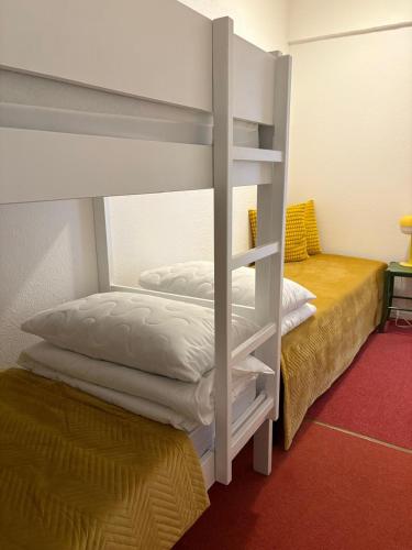 Un ou plusieurs lits dans un hébergement de l'établissement Superbe appart au golf de St Cyprien Piscine