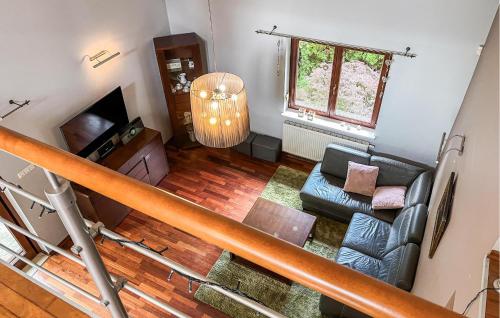 an overhead view of a living room with a couch and a television at Five Bedroom Cozy Home In Jerzykowo 