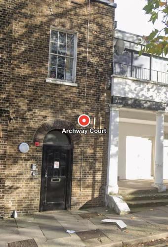 an entrance to a brick building with a black door at 2Bed Apartment-Free Parking Pets Garden Central in London