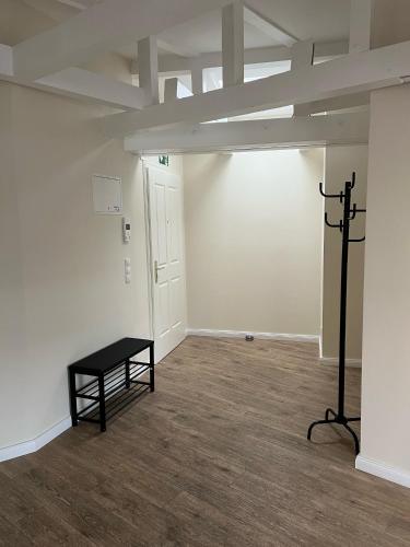 a room with a black table and a white wall at Alster Stay no 45 in Hamburg