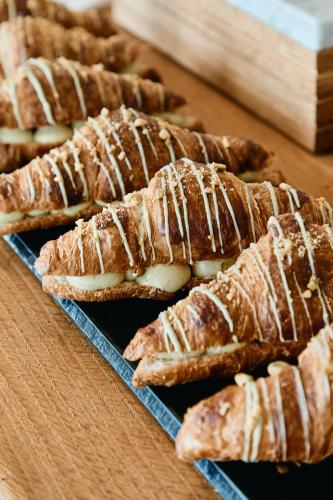a group of pastries on a plate on a table at Hôtel de la Mer & Spa in Brignogan-Plages