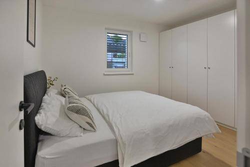 Postel nebo postele na pokoji v ubytování URBAN LODGE PREMIUM Apartments