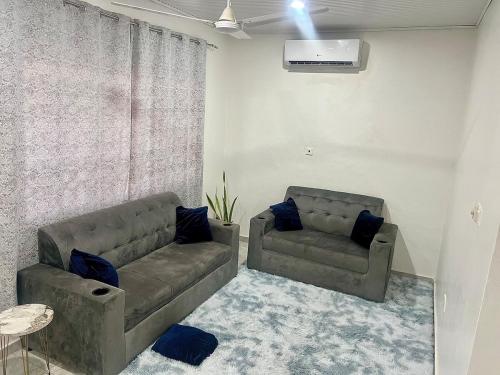 a living room with a couch and a table at Lighthouse in Trofwi