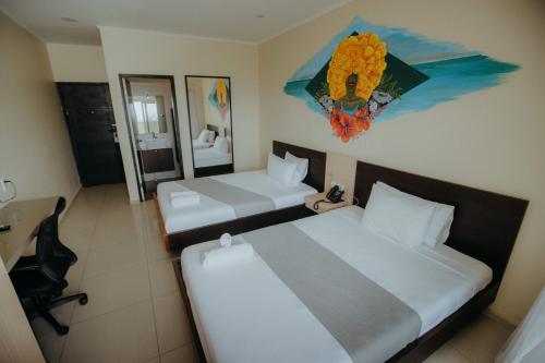 Postel nebo postele na pokoji v ubytování Curacao Airport Hotel
