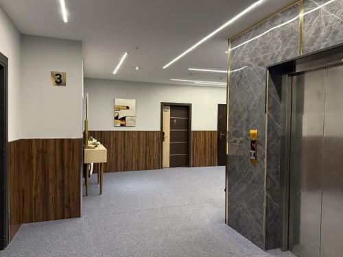 a hallway with a door in a building at MyHotel Erbil in Erbil