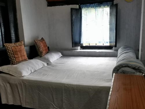 Postel nebo postele na pokoji v ubytování Bala Ai Bynta Homestay