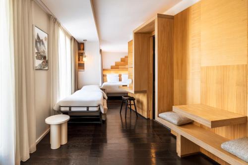 Postel nebo postele na pokoji v ubytování Le Citizen Hotel