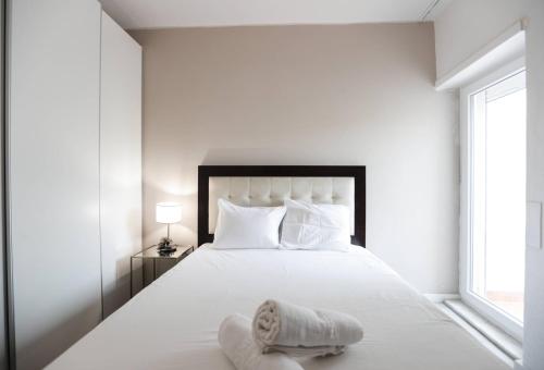 Postel nebo postele na pokoji v ubytování Lisbon South Beach Apartment