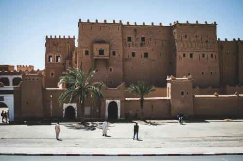 people standing in front of a large building at Desert Soul Camp in Erfoud