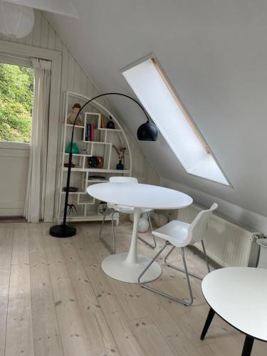 a room with two tables and two chairs at Sølyst in Silkeborg