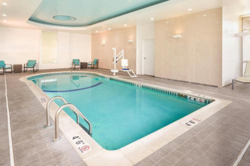 a large swimming pool in a hotel room at SpringHill Suites by Marriott Philadelphia Airport / Ridley Park in Ridley Park