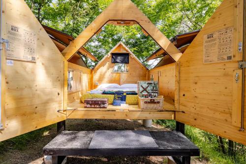 a tree house with a bed in the middle at StarsBox Cinque Terre - America in Carrodano Inferiore
